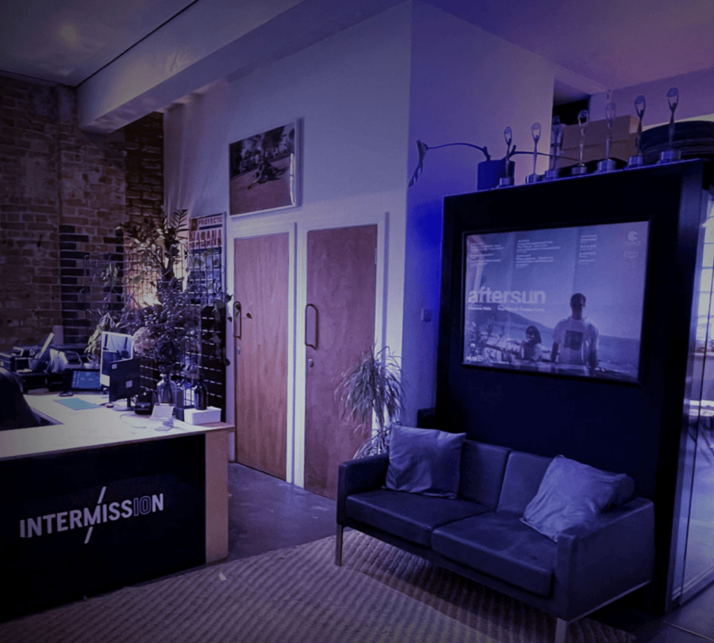 Intermission Film reception with branded front desk, award trophies and an Aftersun poster