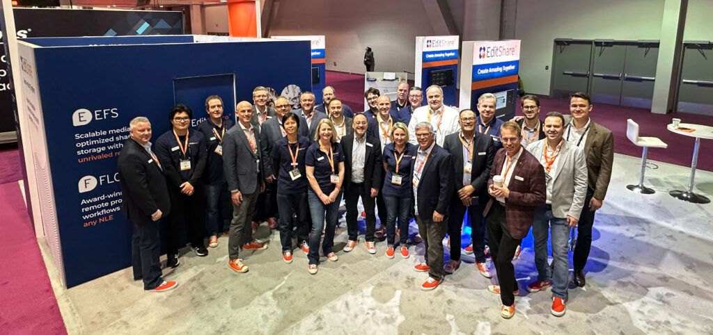 EditShare team in orange sneakers at the EFS and FLOW booth at NAB 2023