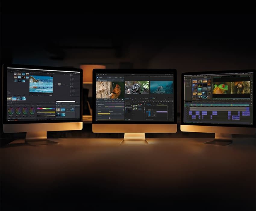 Three monitors running DaVinci Resolve, Premiere Pro, and Media Composer, representing FLEX Sync integrations