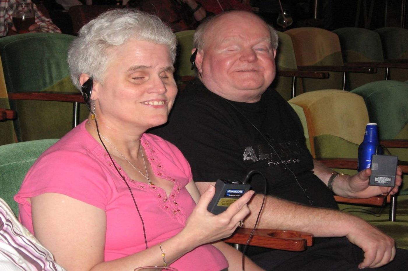 Berl and Denise Colley listen to audio description via FM receivers