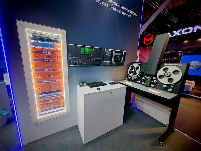 EditShare IBC 2024 stand with the Ultimate EFS Series rack display, grading monitors and a film scanner