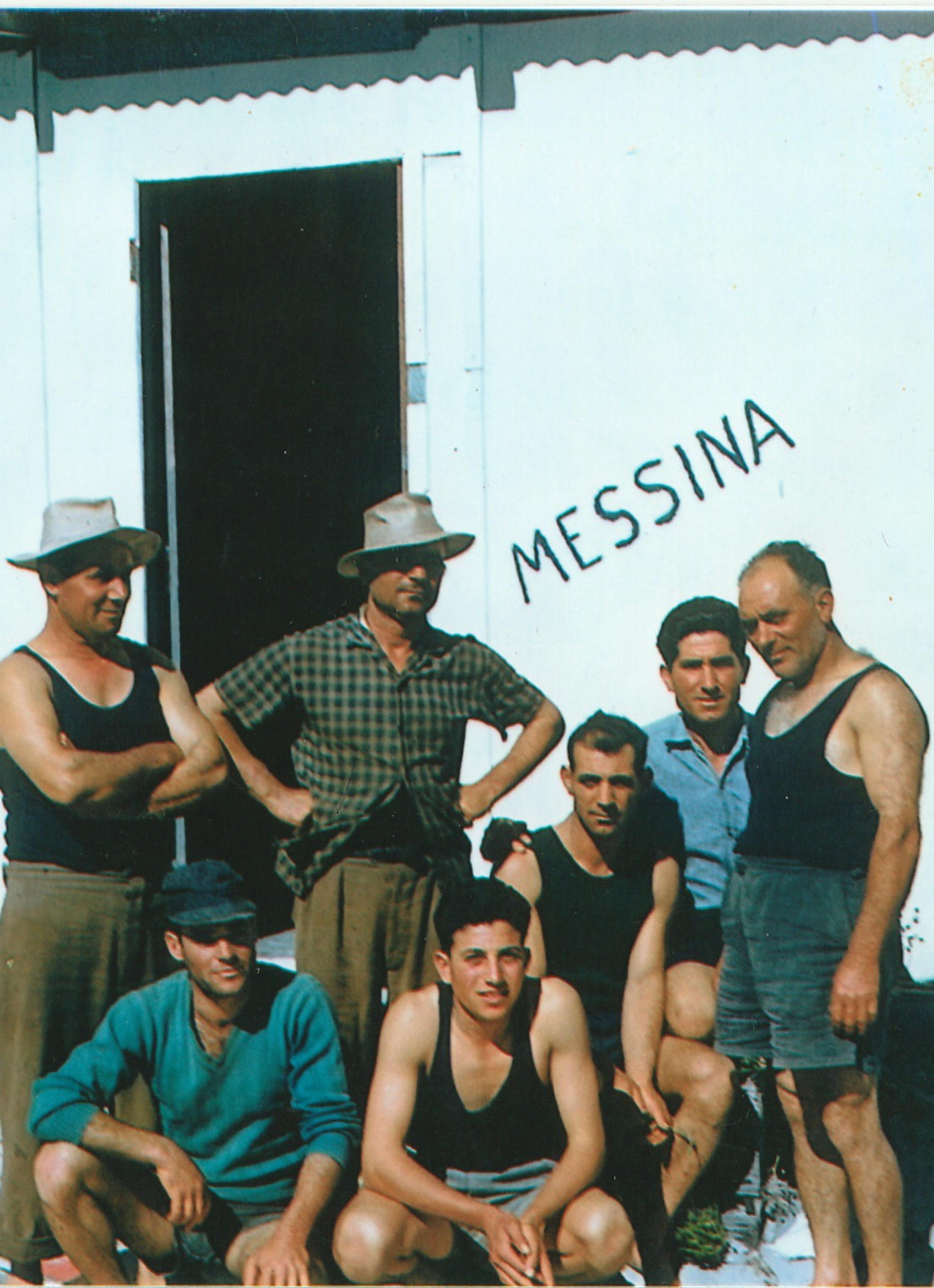 A photo of the fishing crew outside their shed at Ledge Point