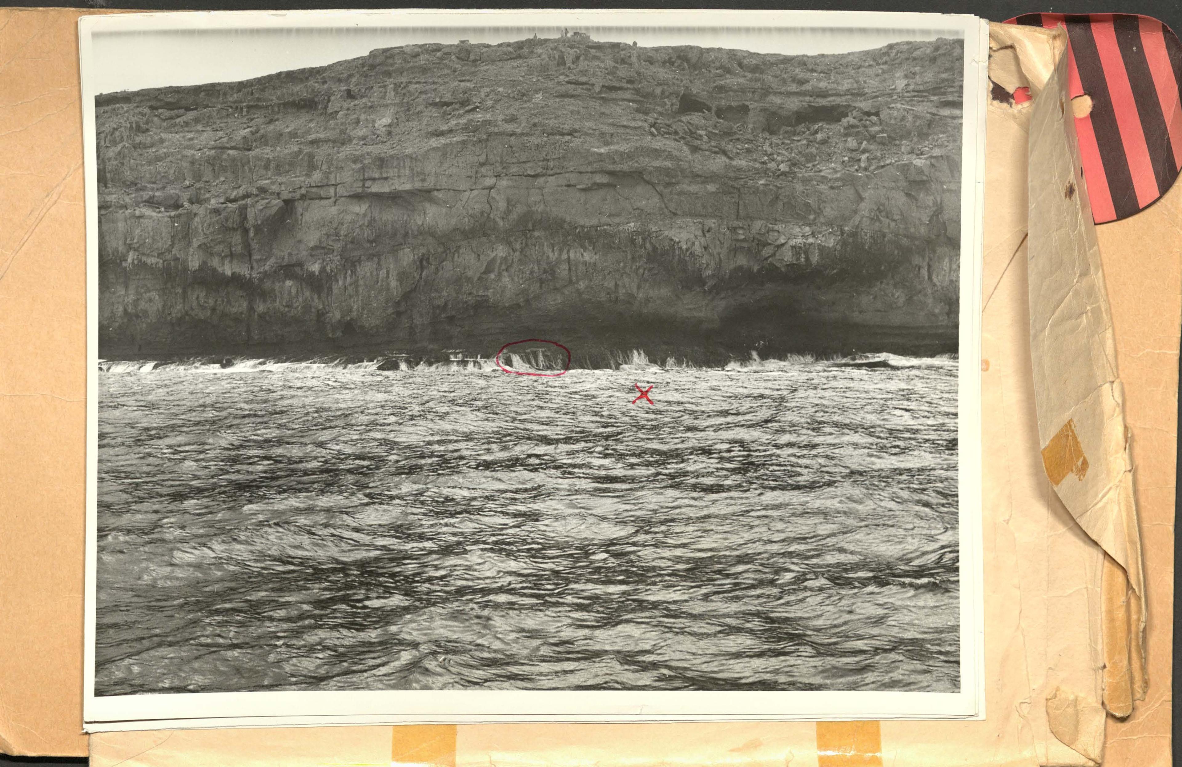 Wreckage location alongside cliffs