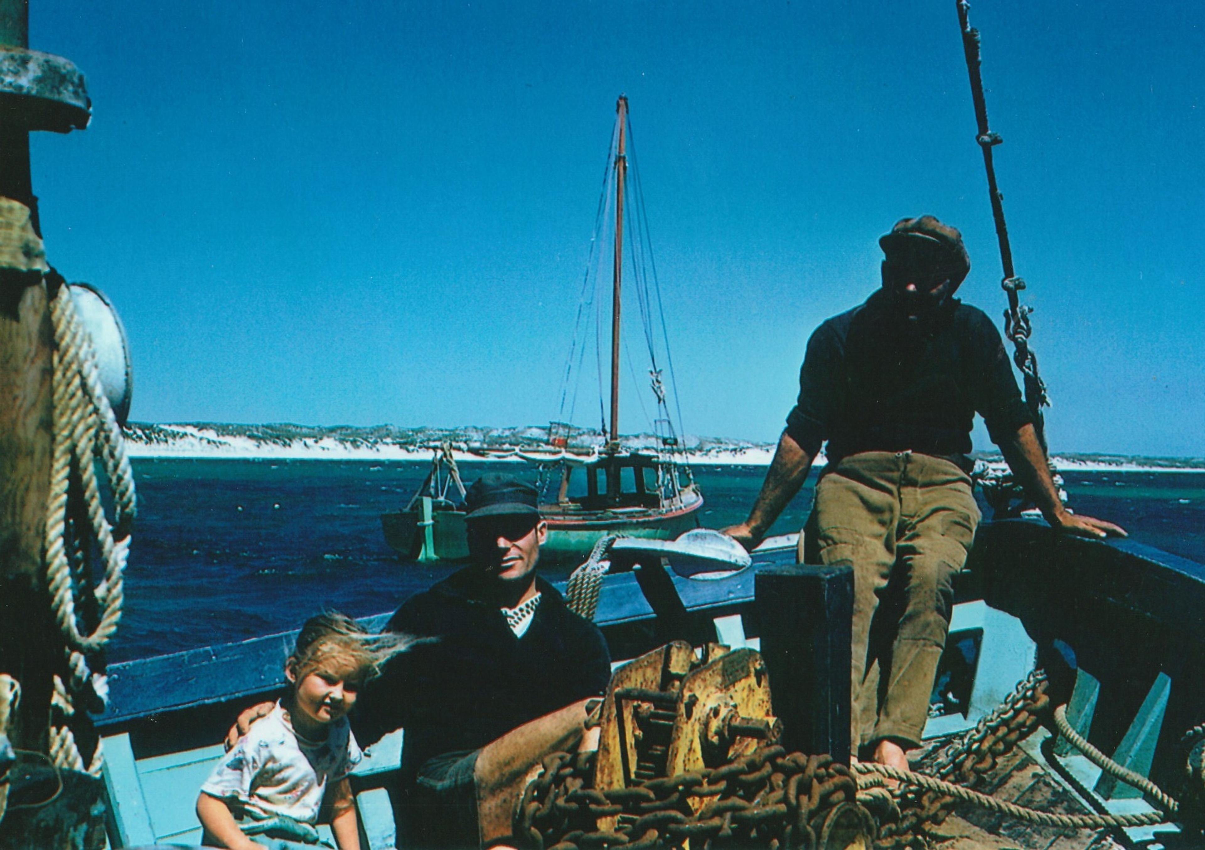 Photo of family sitting in the bow of Messina