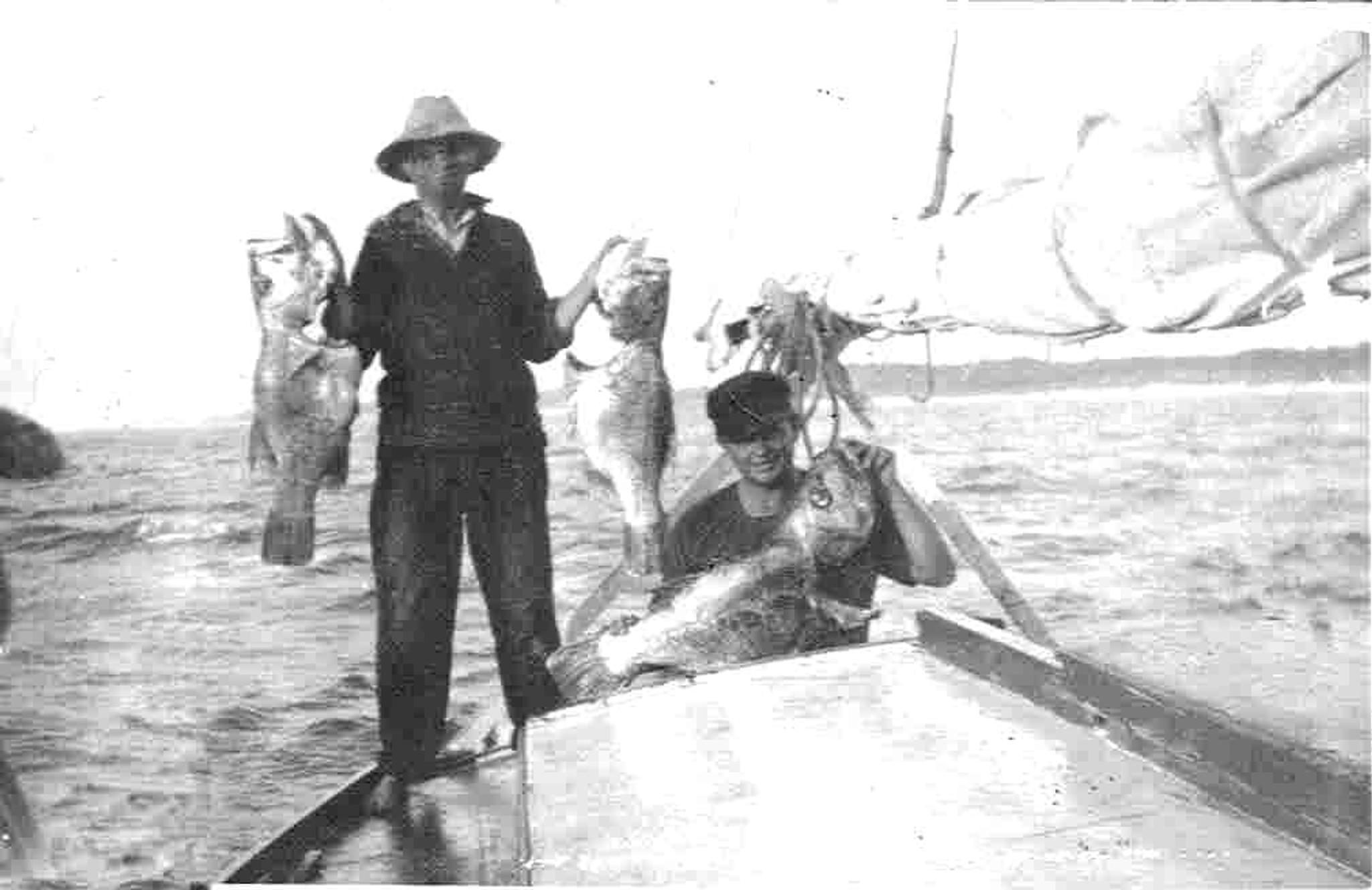 Sydney Knowler standing upright holding Dhu Fish in 1937