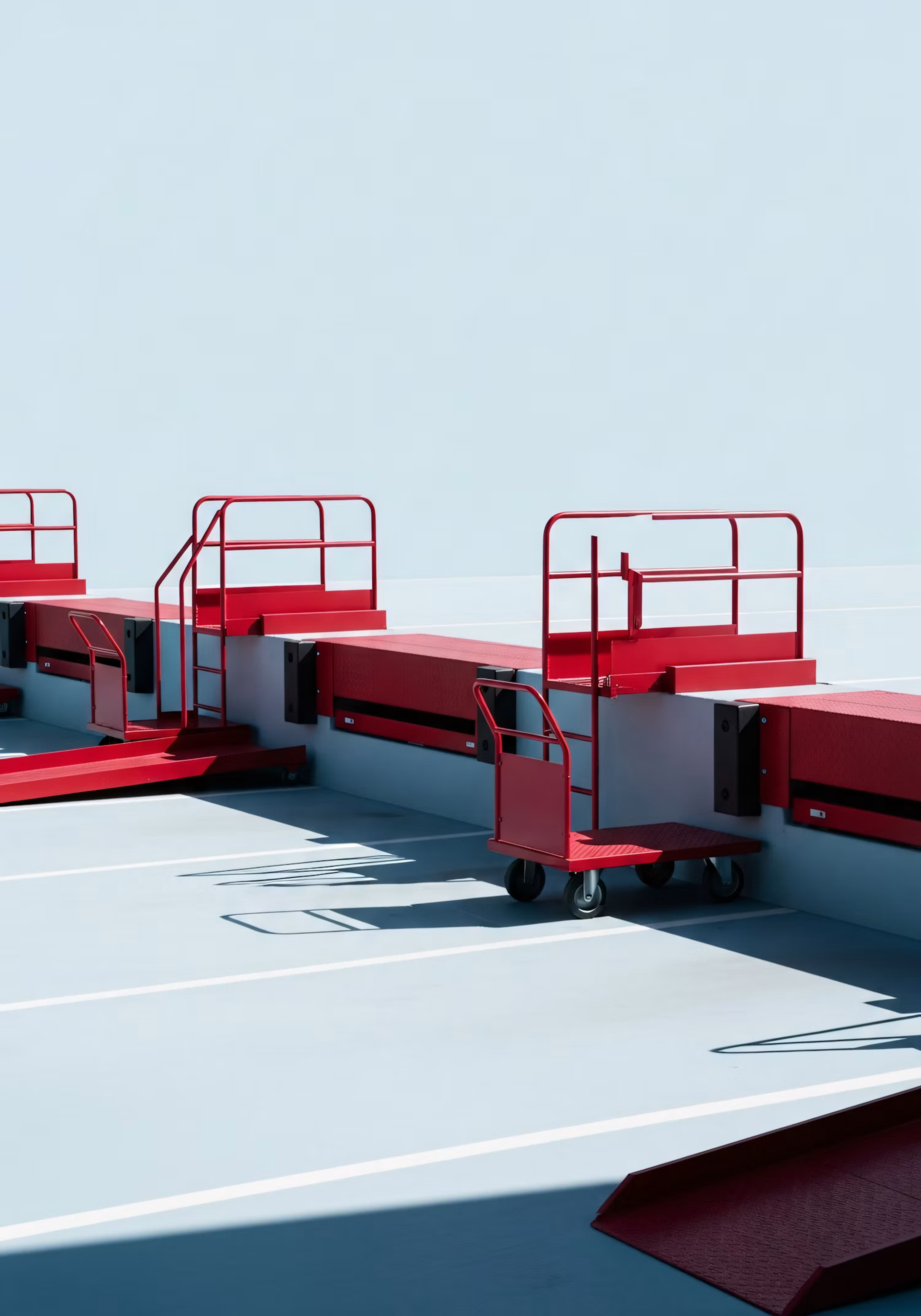 Red steps and railings on a pale blue rooftop