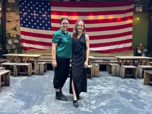 Impact at Scale - American Flag with people in front