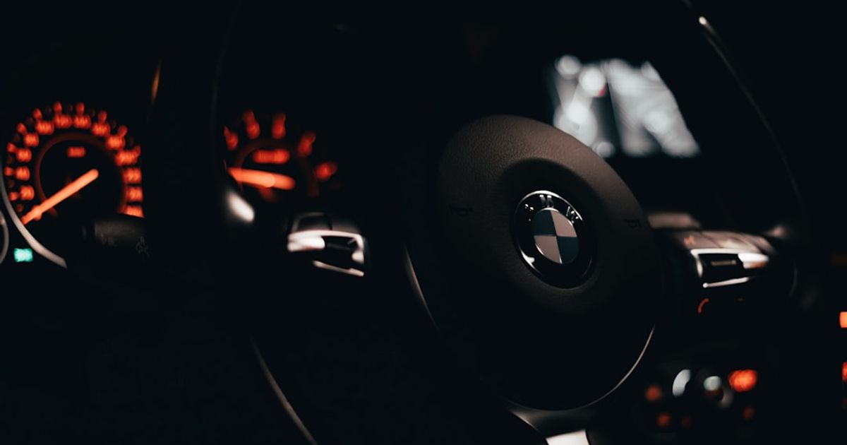 Why Is My BMW CarPlay Not Working? Wireless Fixes by iDrive — black bmw car steering wheel