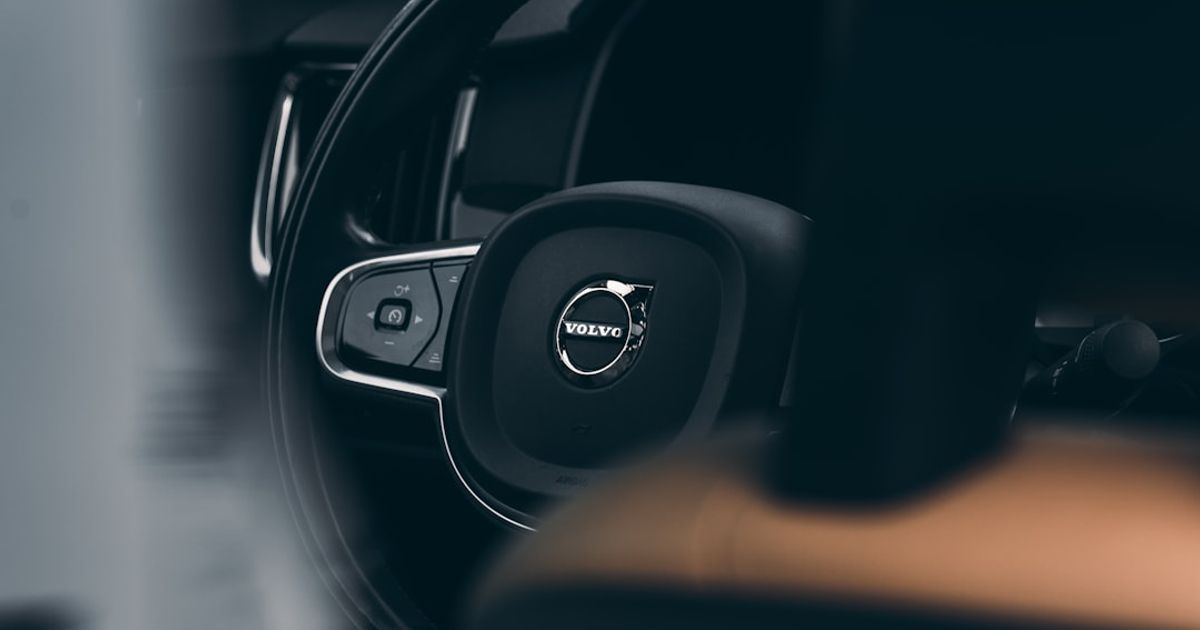 Volvo CarPlay Not Working? The Sensus & Google Built-in Fix Guide — black bmw car steering wheel