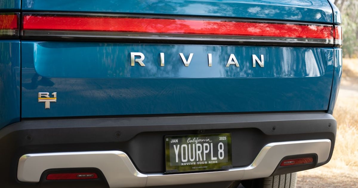 How to Set Up CarPlay in Your Rivian (R1T, R1S & R2) — the back end of a blue car with a license plate
