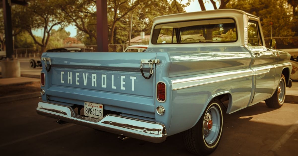 Does GM Have Apple CarPlay? Which Models Have It in 2026 — white chevrolet single cab pickup truck parked on road during daytime