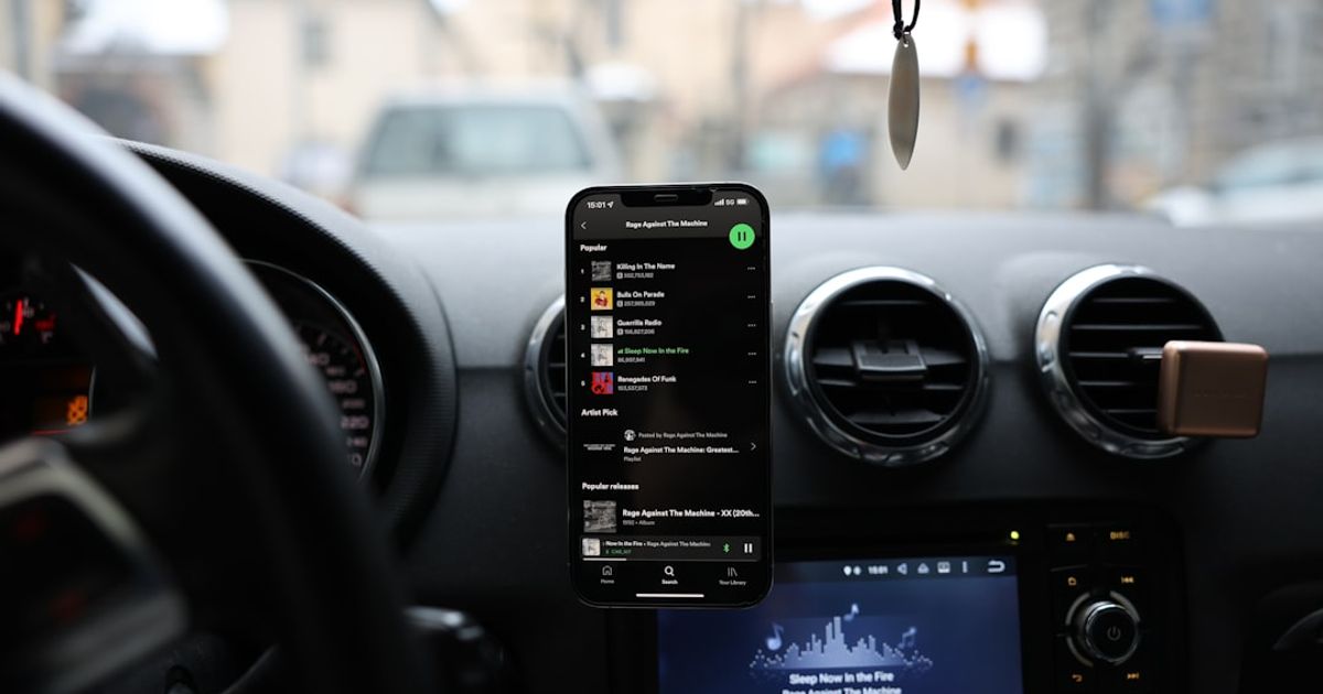 How to Set Up Apple CarPlay: First-Time Setup for Wired & Wireless (iOS 26) — a car dashboard with a cell phone and gps