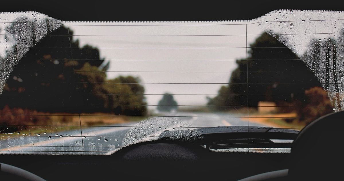 Driving on a rainy road, view through the car window