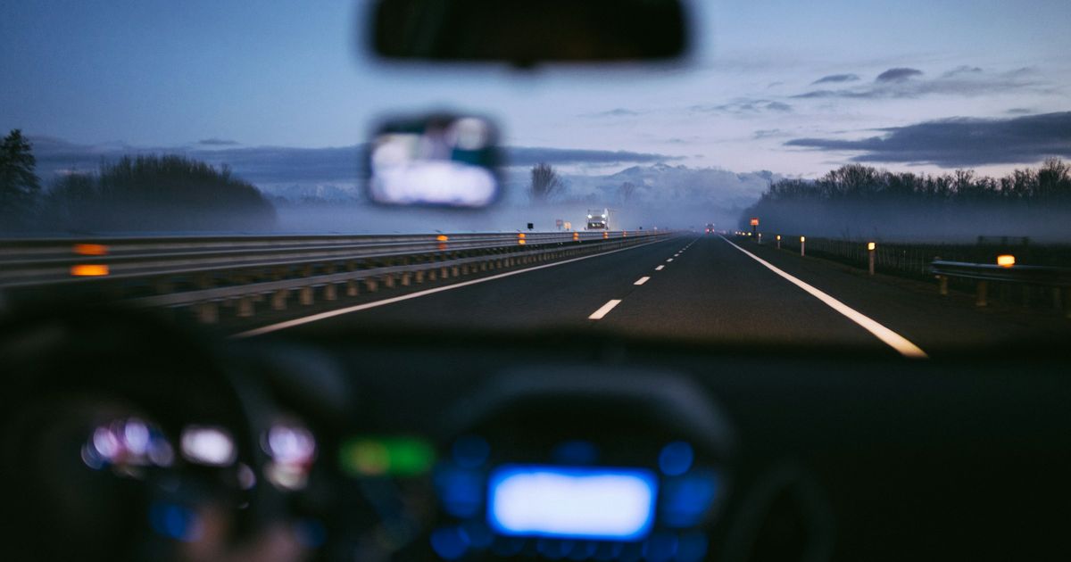 Driving on a highway at dusk