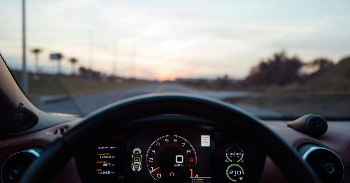 Car instrument cluster and dashboard at sunrise