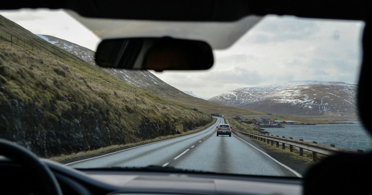 Coastal mountain road through the windshield