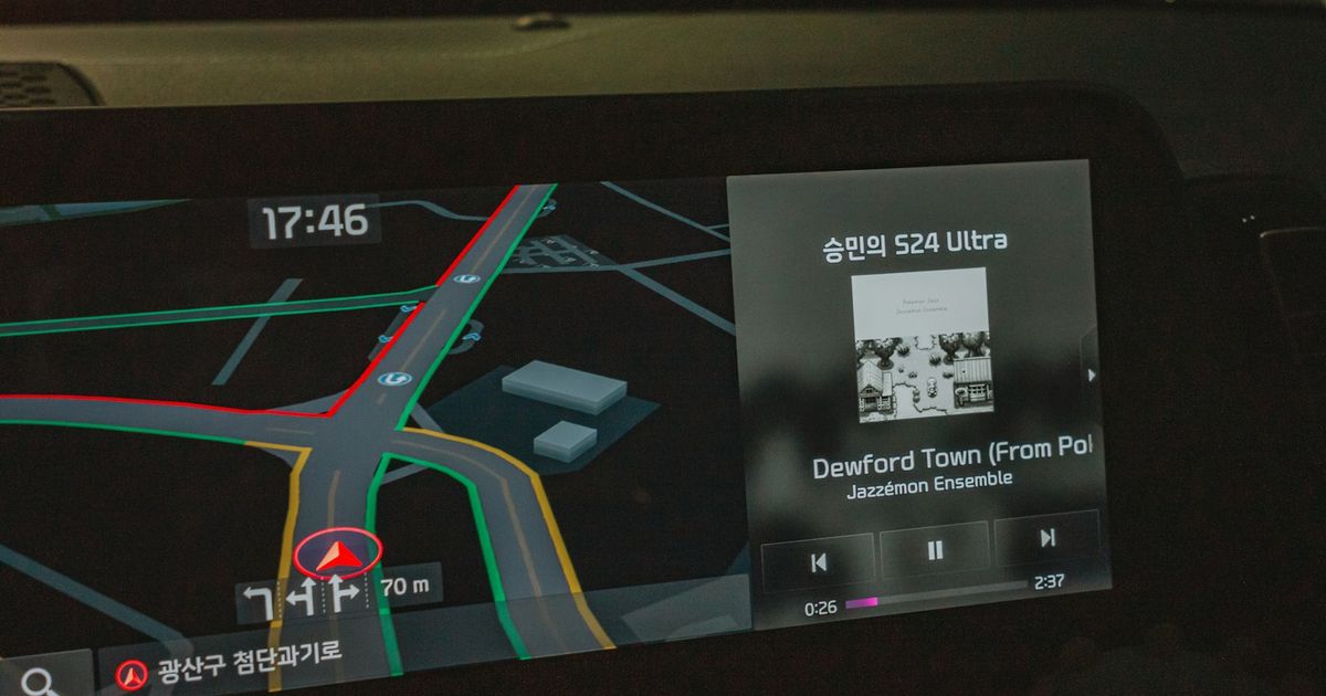 How to Get the iOS 26.4 CarPlay Updates — Car navigation screen showing map and music player