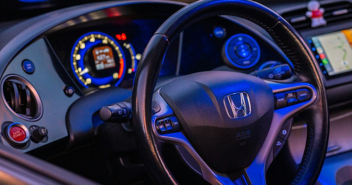 Honda CarPlay Not Working — Civic, Accord, CR-V Fix Guide (2026) — a steering wheel and dashboard of a car