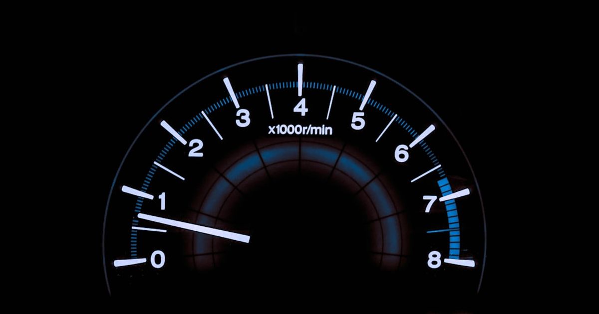 How to Get a Speedometer on CarPlay in iOS 26 — white and blue analog tachometer gauge