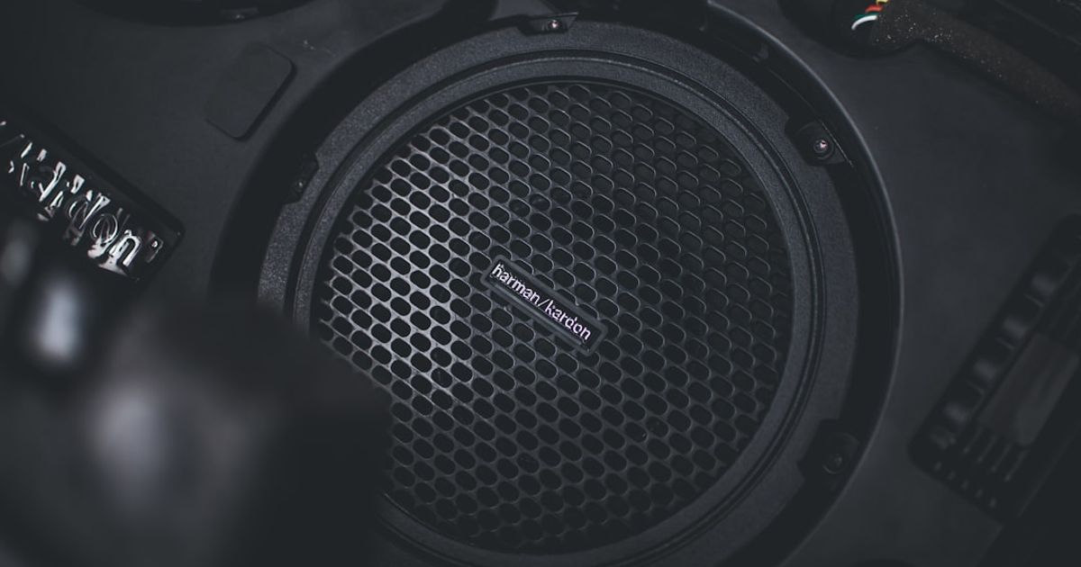10 Best CarPlay Startup Sound Ideas for 2026 (With Free Downloads) — a pair of headphones sitting on top of a speaker