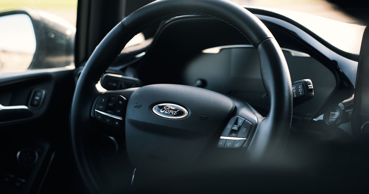 Ford CarPlay Not Working? The Fix Order for SYNC 3 and SYNC 4 — black nissan car steering wheel