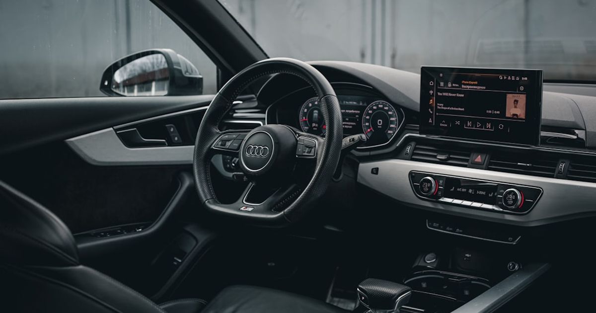 Audi CarPlay Not Working? The Field-Tested Fix Order (A3, A4, Q5, e-tron GT) — the interior of a car with a steering wheel and dashboard