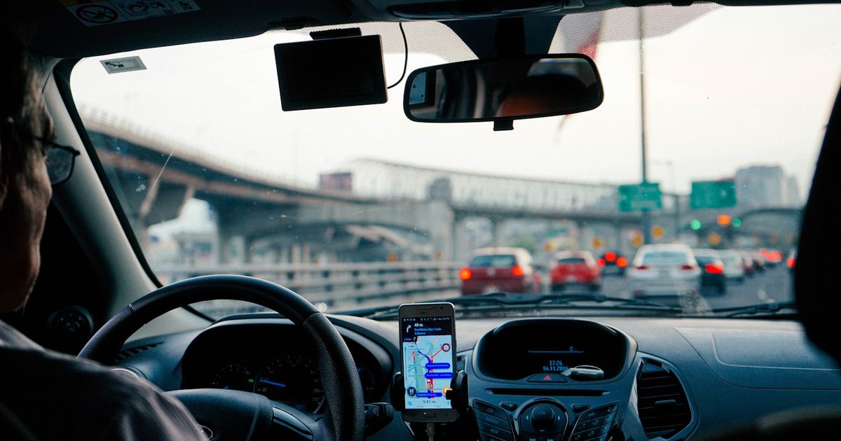 Bluetooth Connected but CarPlay Not Working? How to Fix It — man driving vehicle with GPS system turned on