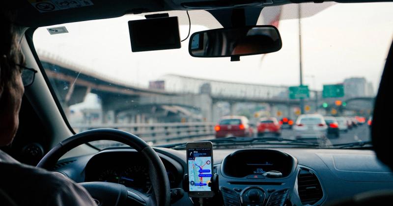 Bluetooth Connected but CarPlay Not Working? How to Fix It — man driving vehicle with GPS system turned on