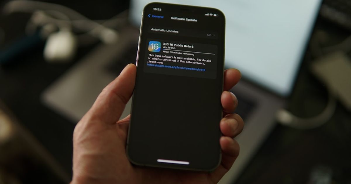 iOS 26.4 Apple CarPlay: Which iPhones and Cars Get It? — a hand holding a phone