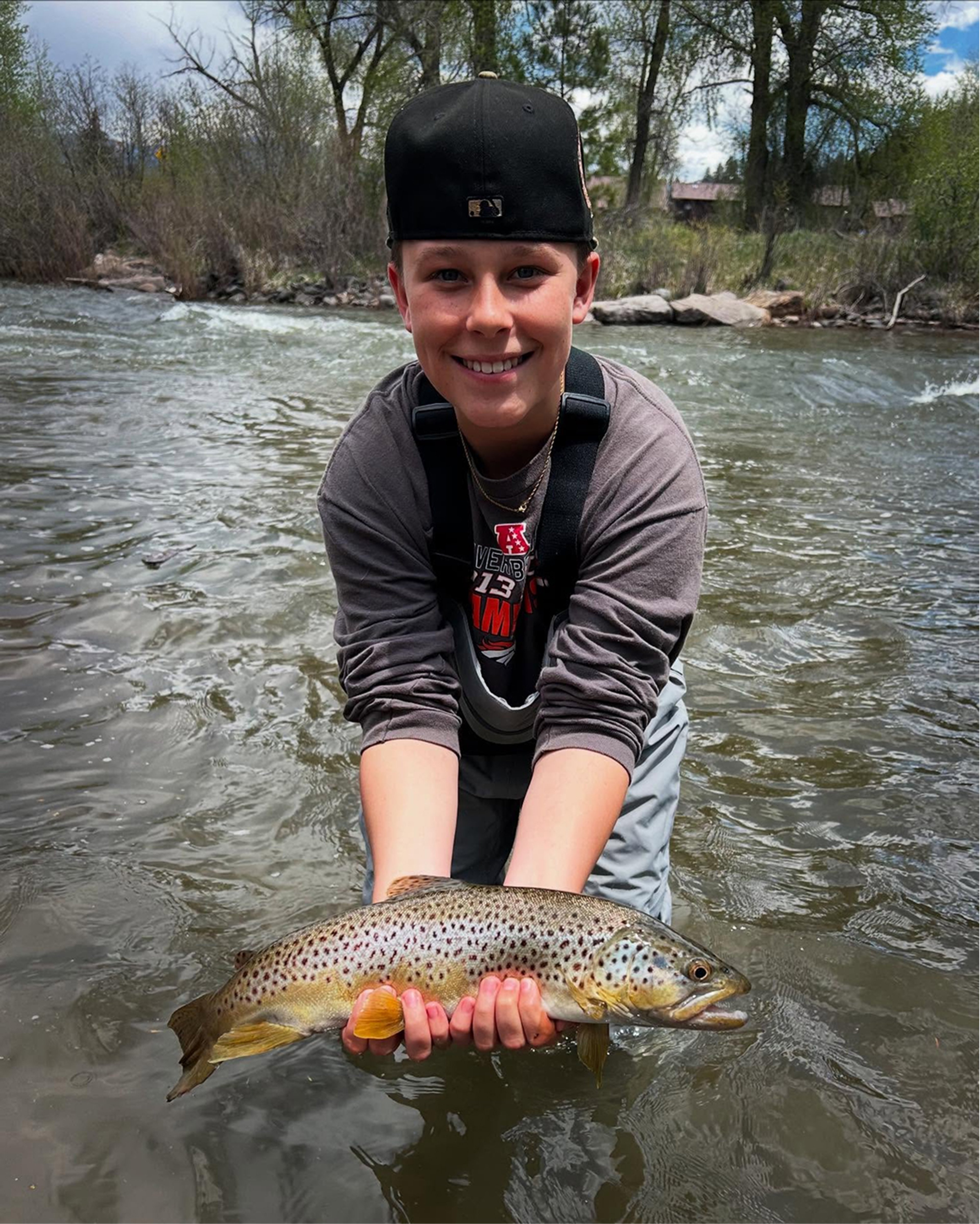 young boy with fish