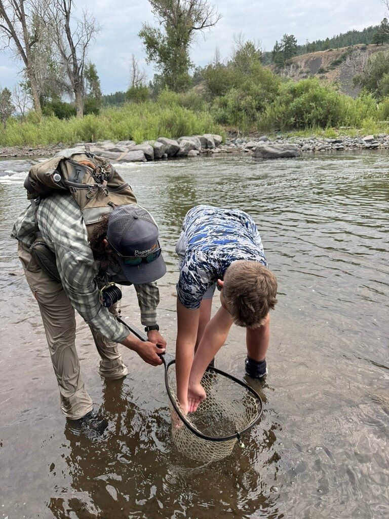 Guests learning on a guided fly fishing trip