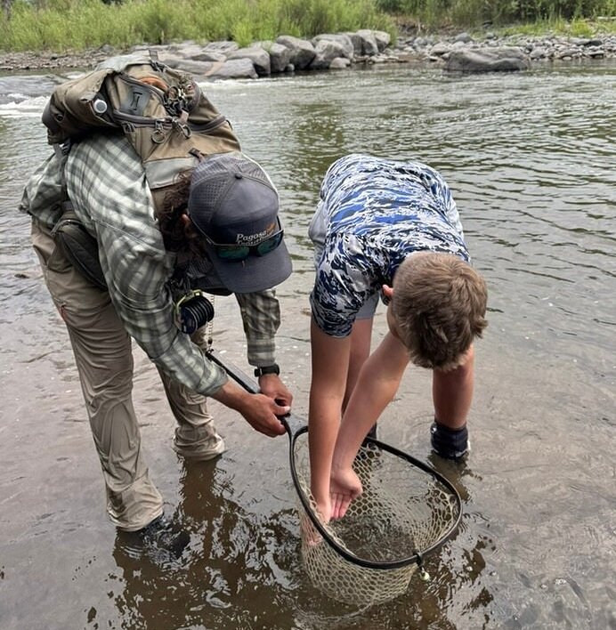 child catching fish