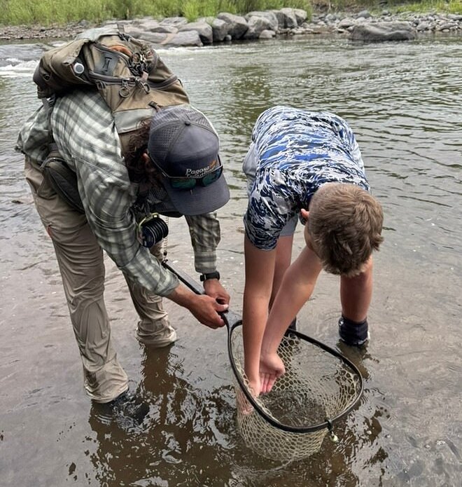 Guests learning on a guided fly fishing trip