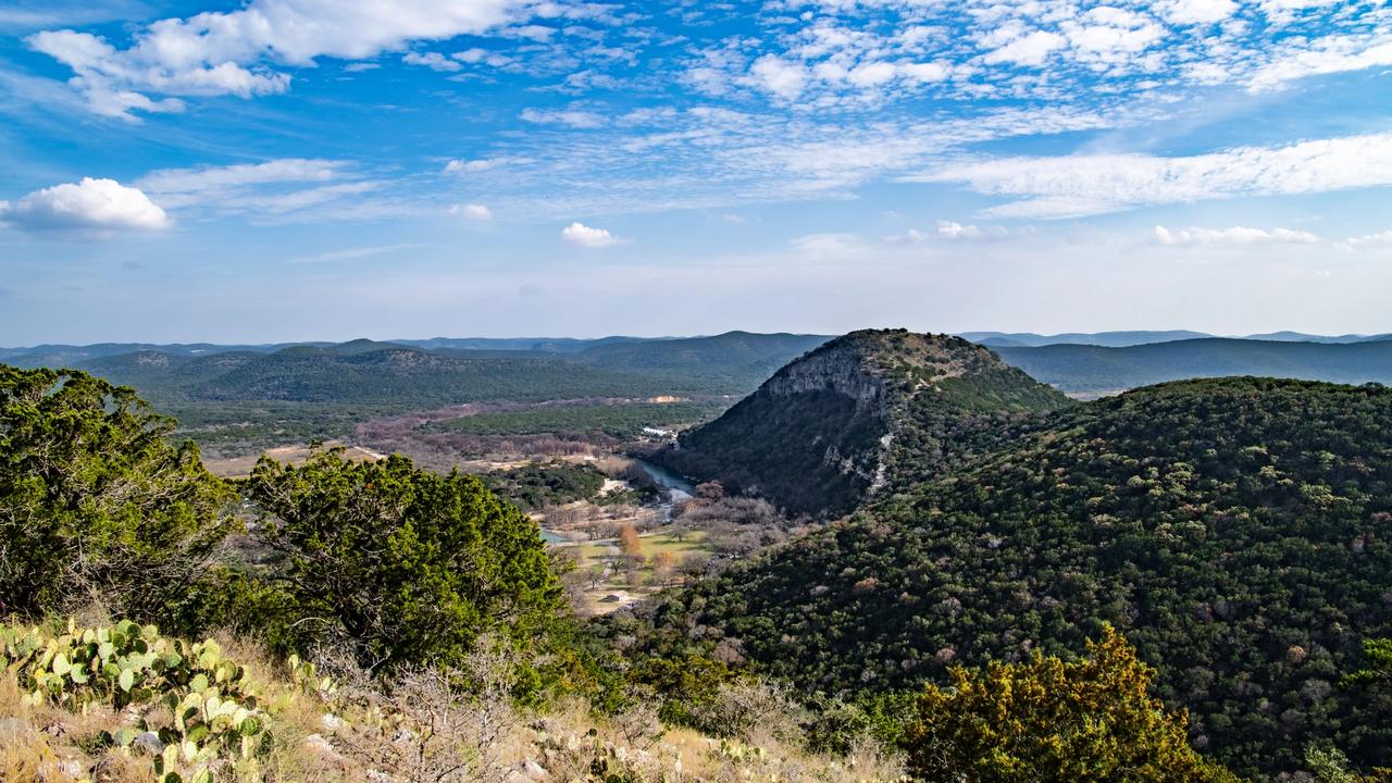 Old Baldy rising above the Frio River at Garner State Park in the Texas Hill Country.