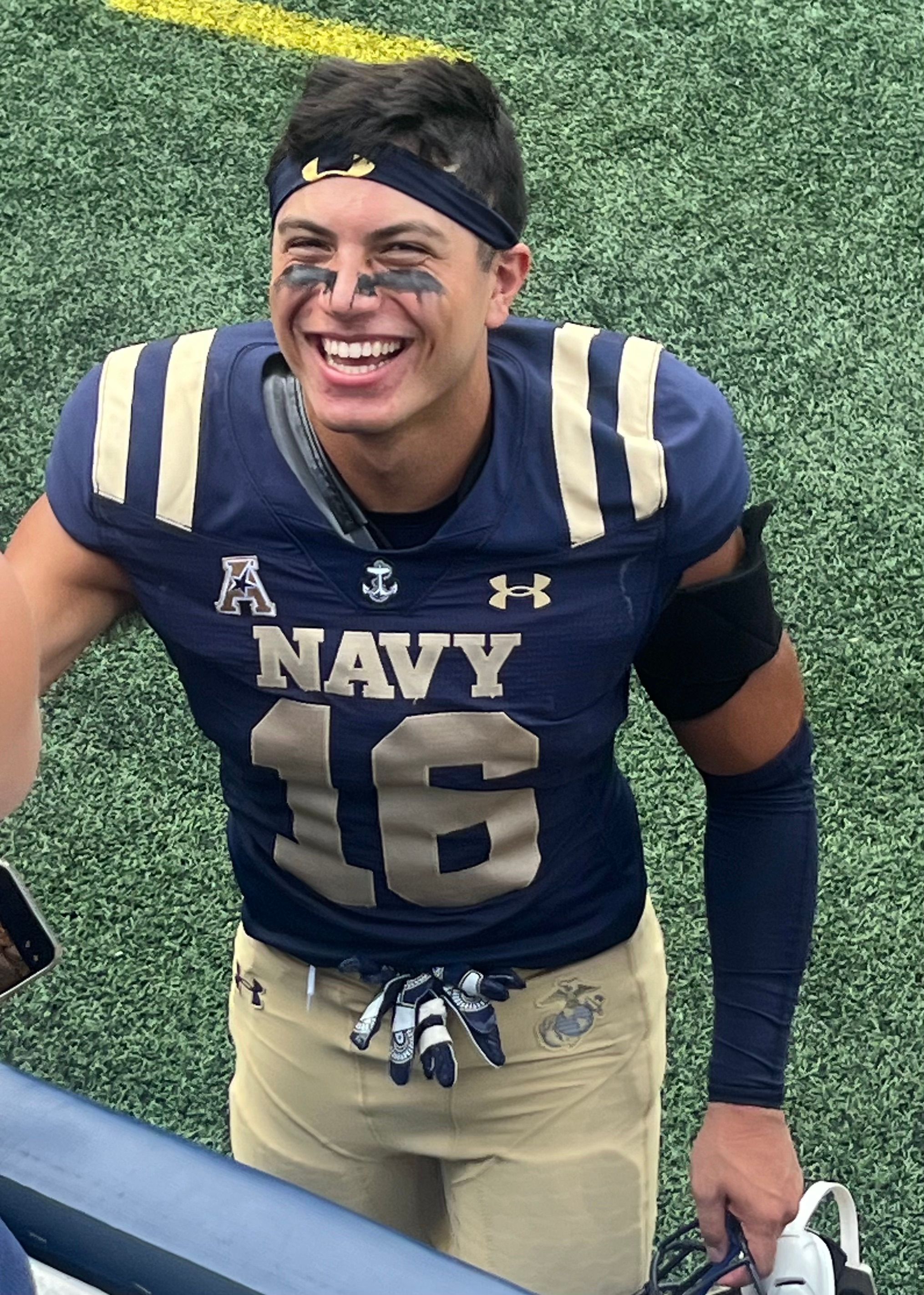 Giuseppe Sessi in his Navy Midshipmen No. 16 jersey on the field.