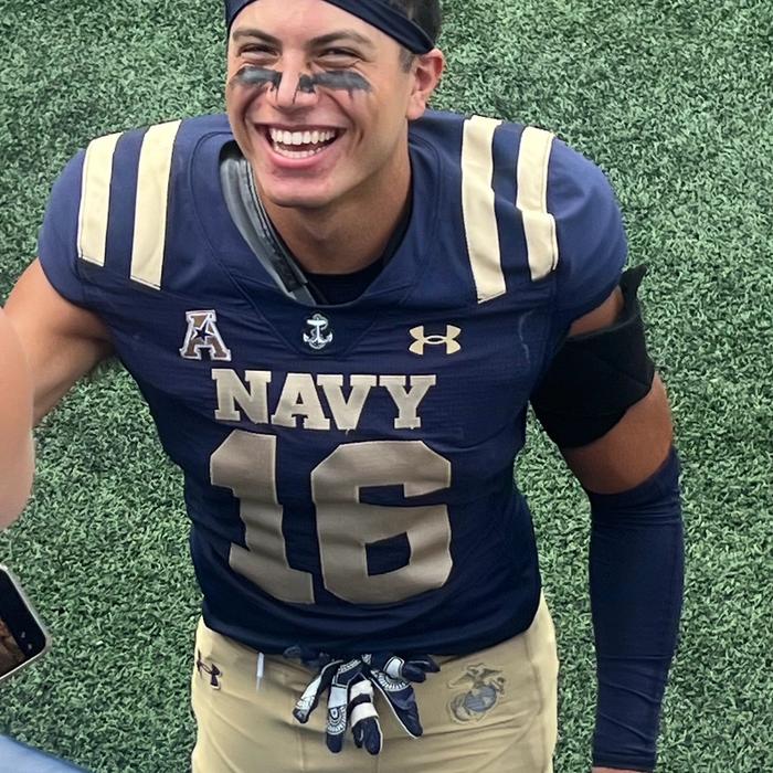 Giuseppe Sessi in his Navy Midshipmen No. 16 jersey on the field.