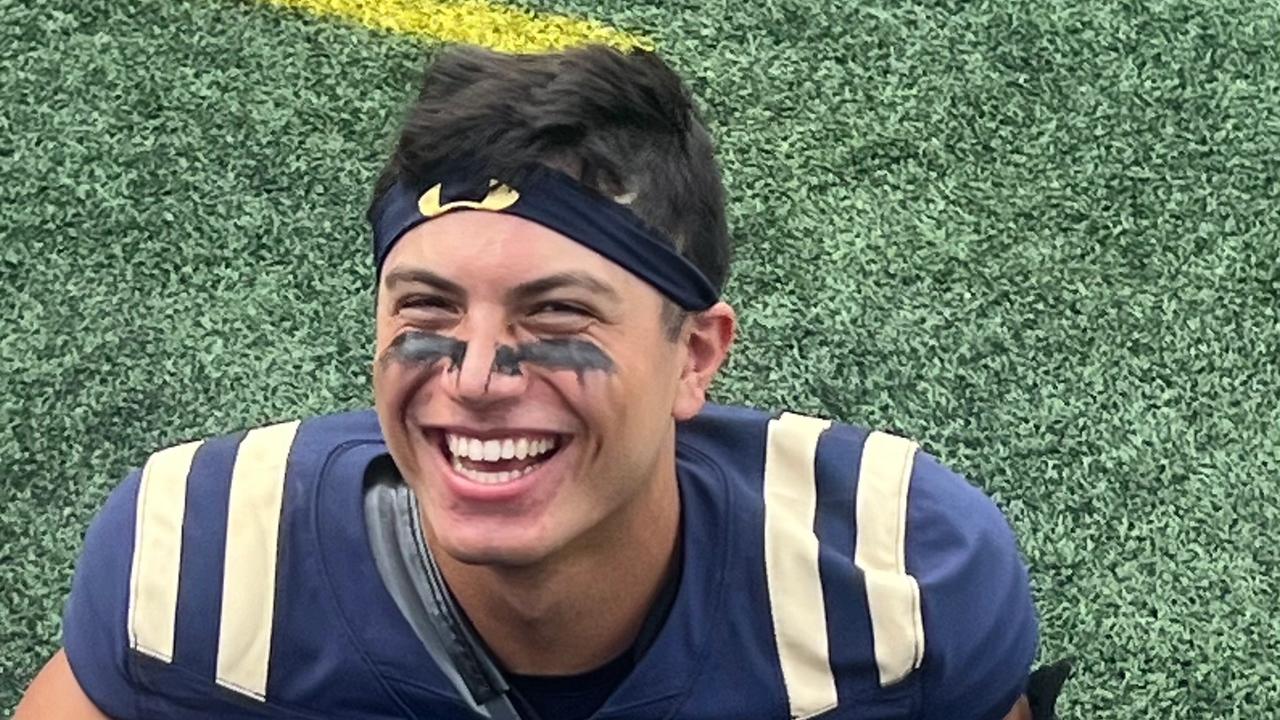 Giuseppe Sessi in his Navy Midshipmen No. 16 jersey on the field.