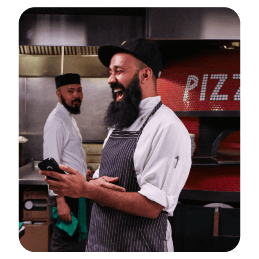 Pizza chef smiling at work photo