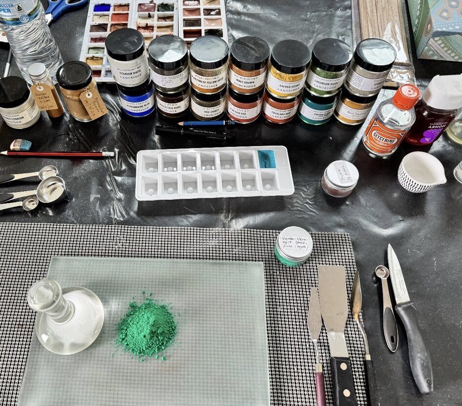 Pigment grinding tools and raw earth colours in the studio