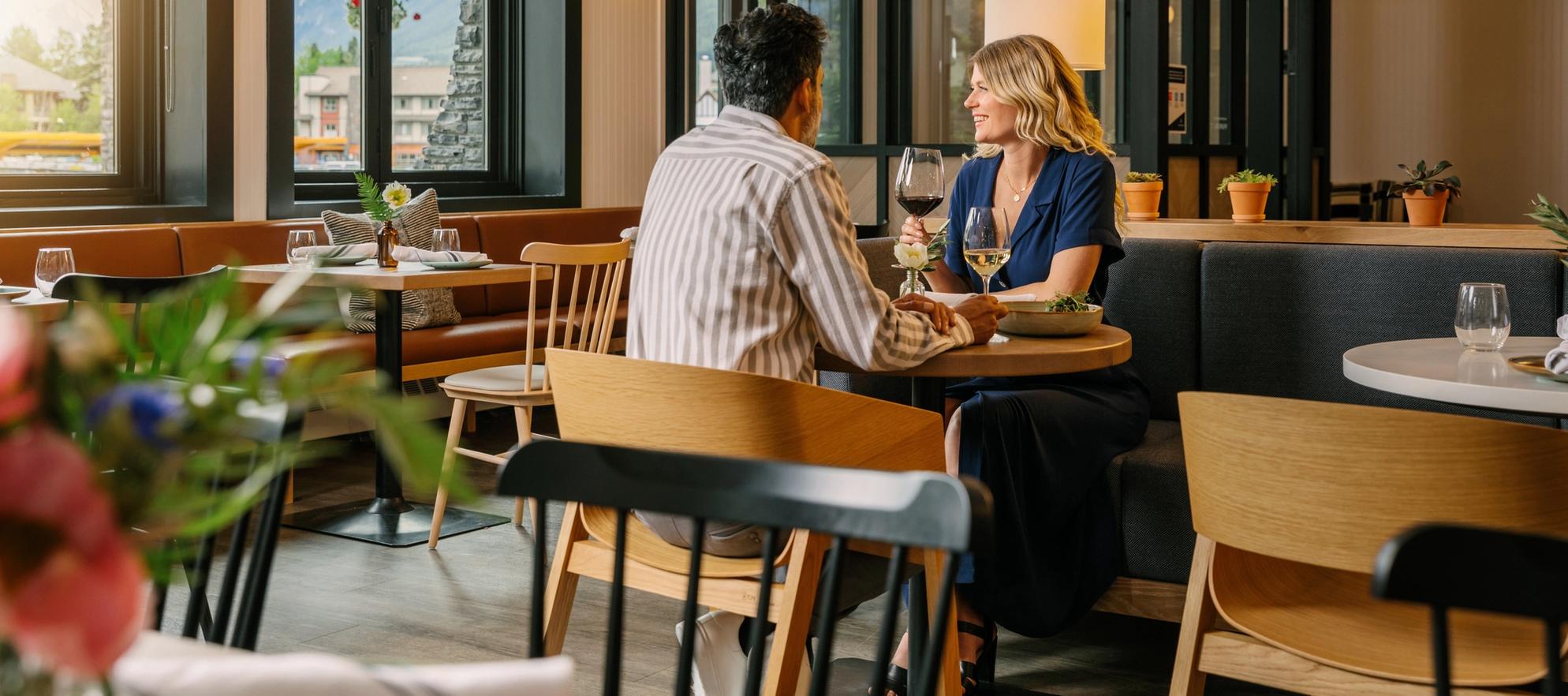 Couple enjoying a date night dinner at Farm & Fire