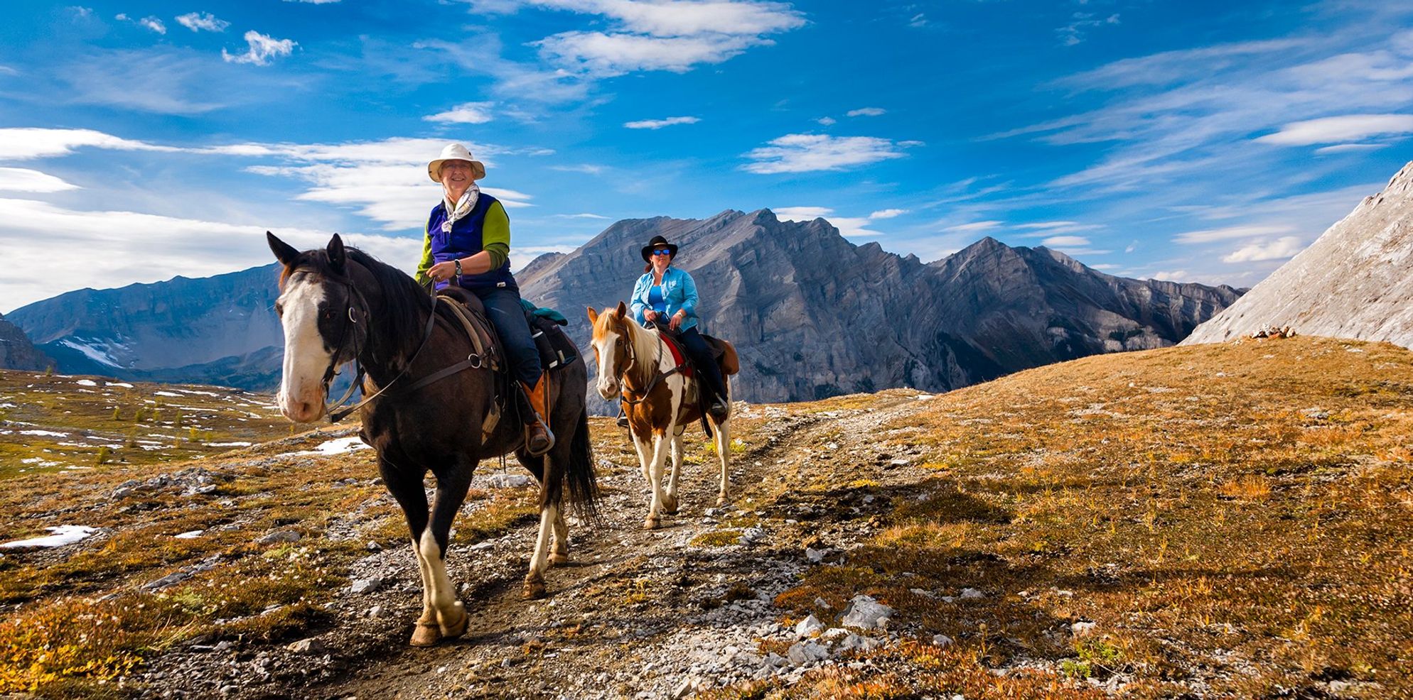 Banff Trail Riders two riders on their horses in the backcountry
