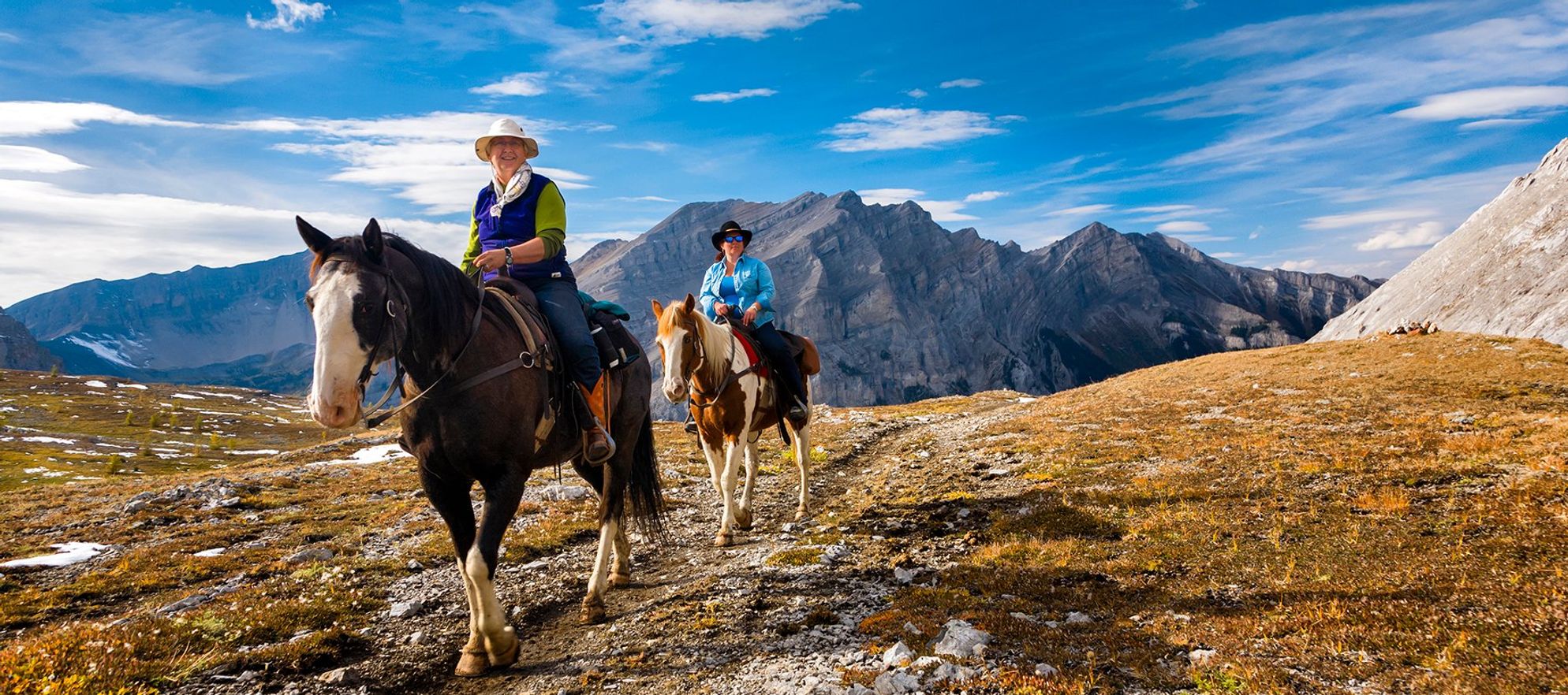 Banff Trail Riders two riders on their horses in the backcountry