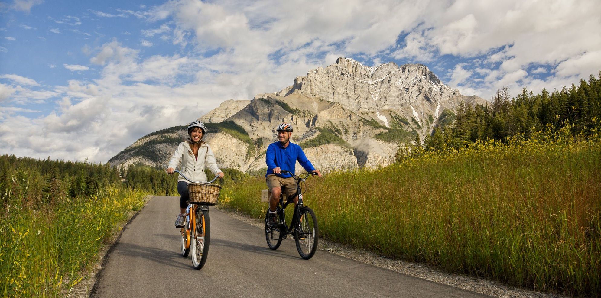 Cyclists make their way down the Legacy Trail in Banff, AB