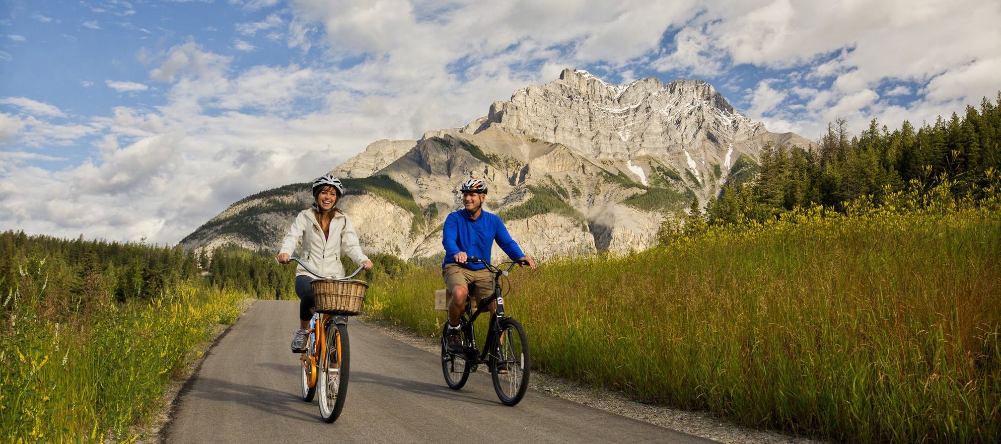 Cyclists make their way down the Legacy Trail in Banff, AB