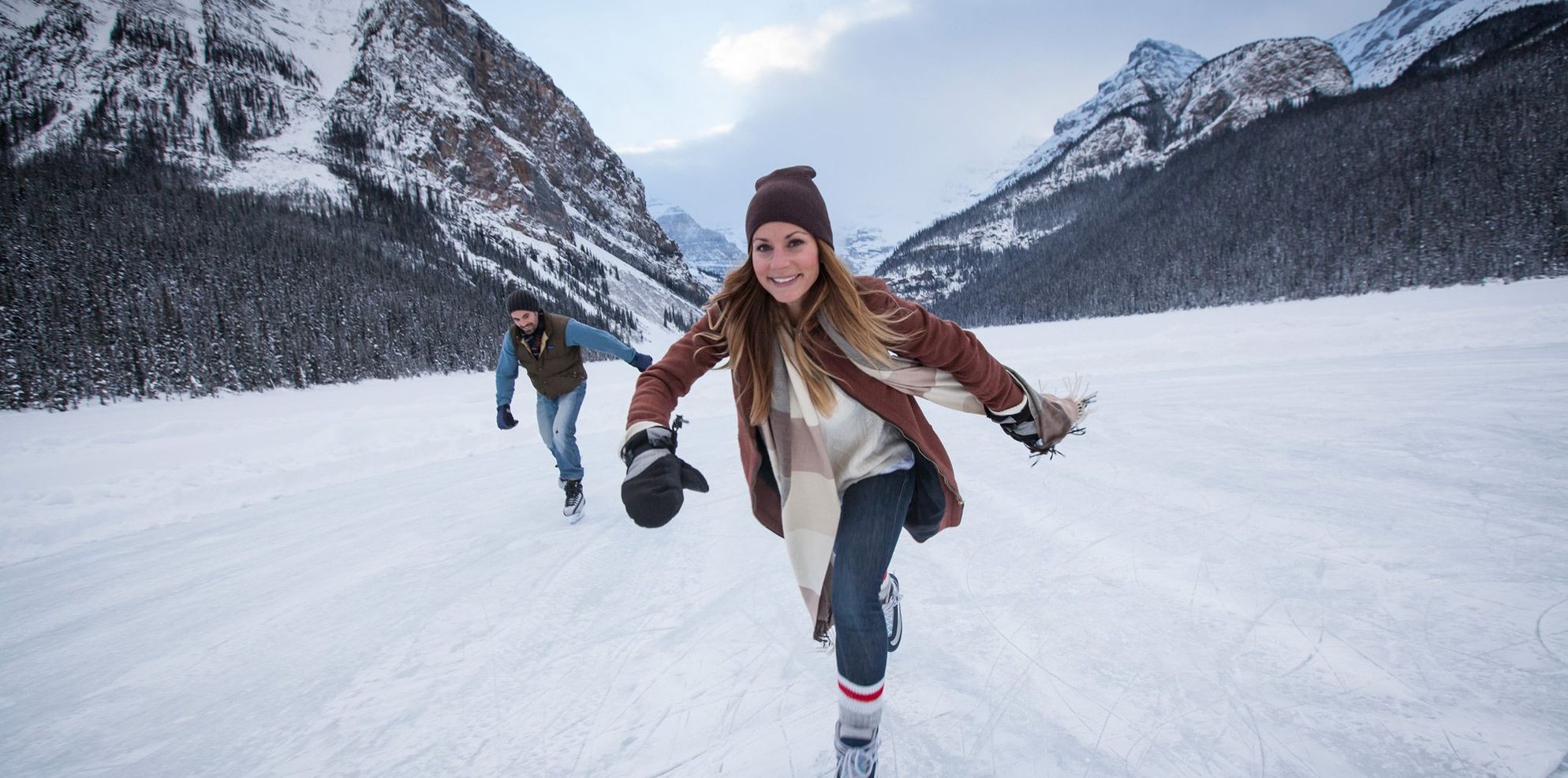 A women skates on Lake Louise, Banff National Park, AB