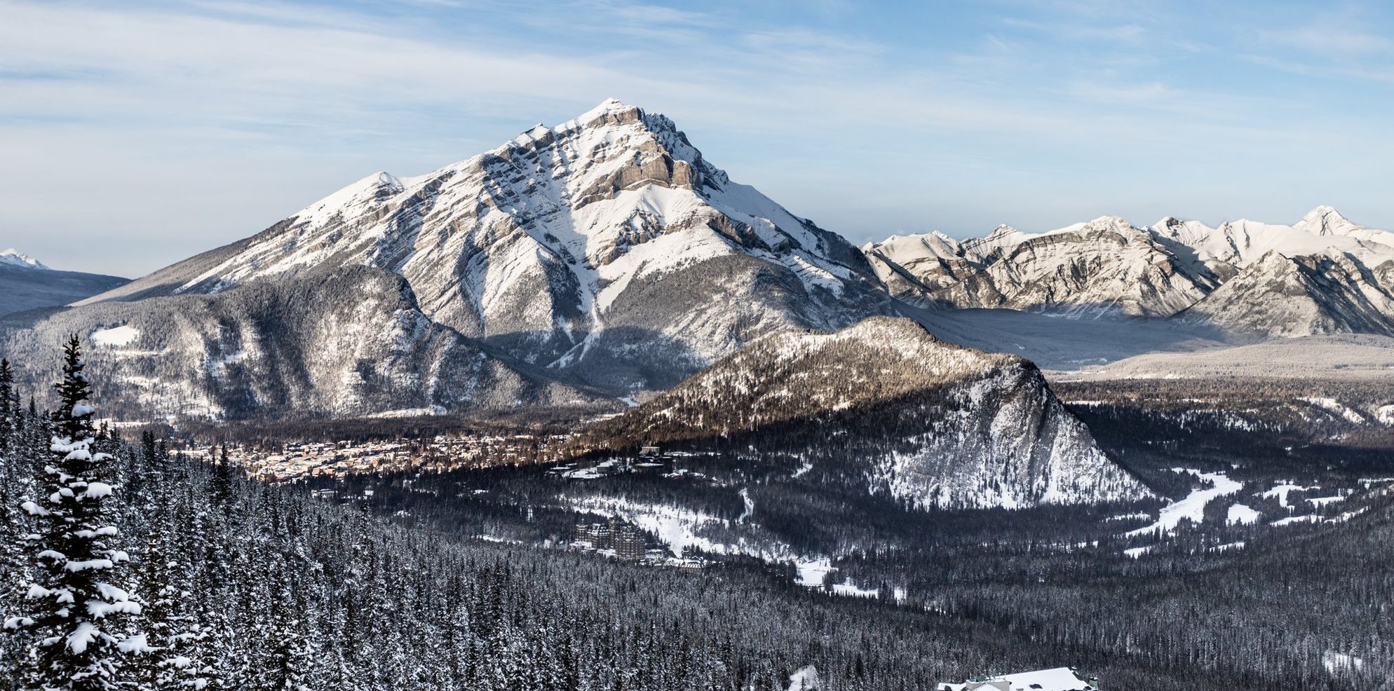 Aerial view of the town of Banff and Cascade Mountain on a snowy winter day