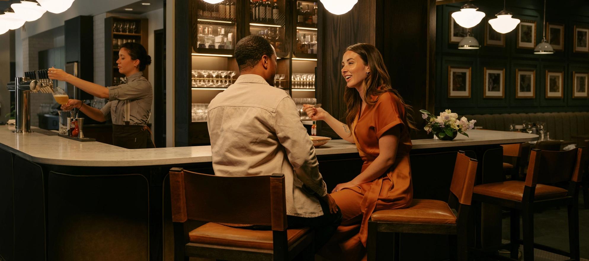 Couple enjoying a date night dinner at Brazen