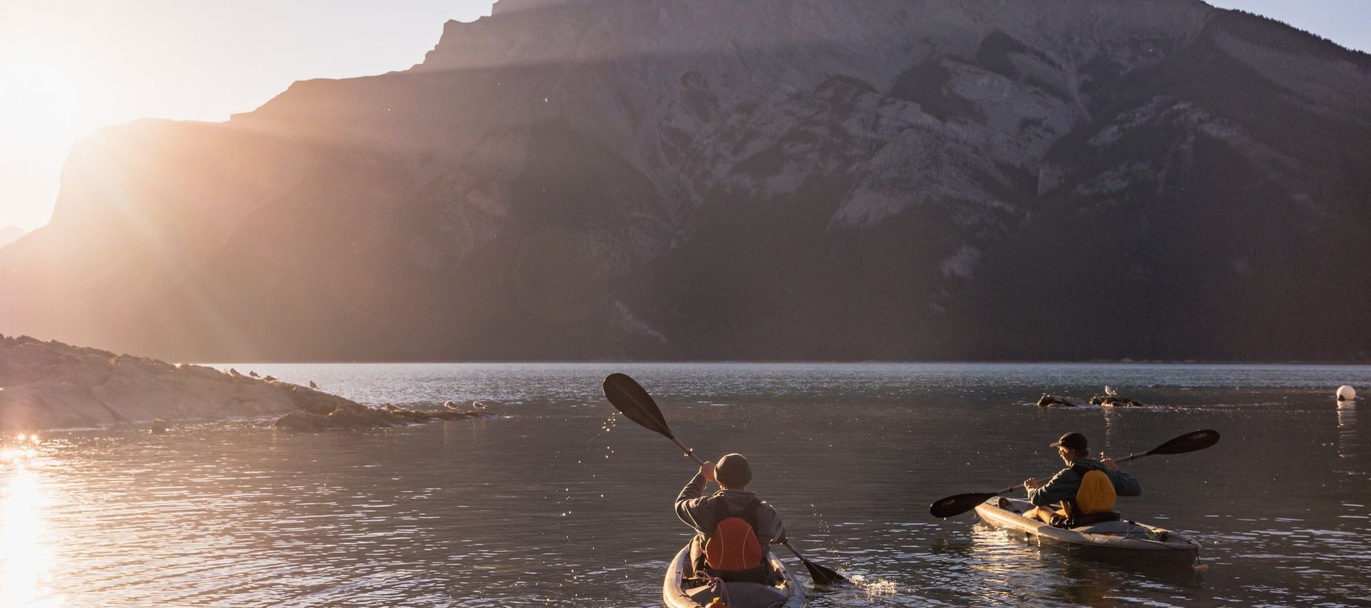 Two kayaks explore Lake Minnewanka in Banff National Park in the Canadian Rockies.
