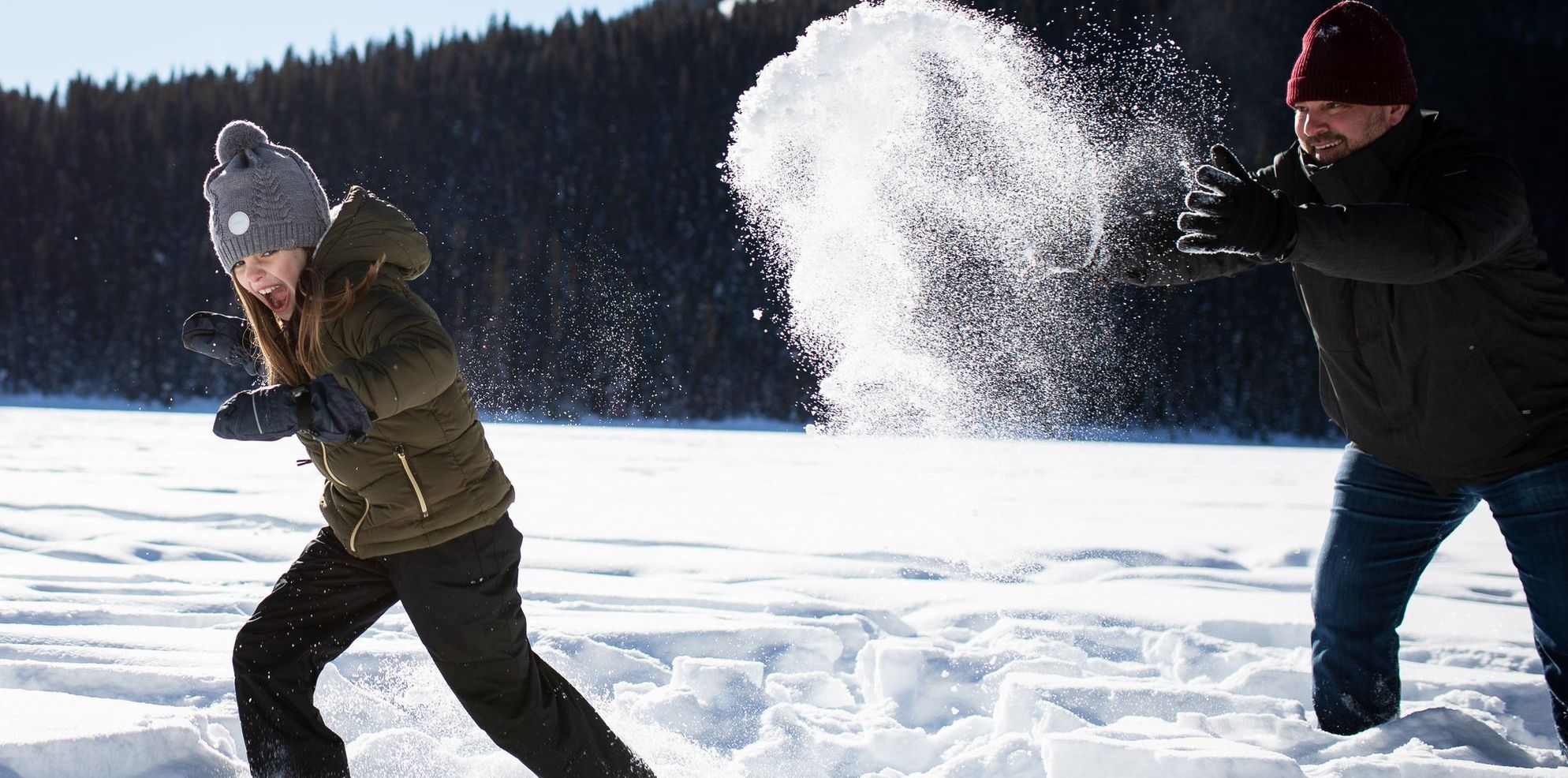 Family walking and hiking in the snow Lake Louise