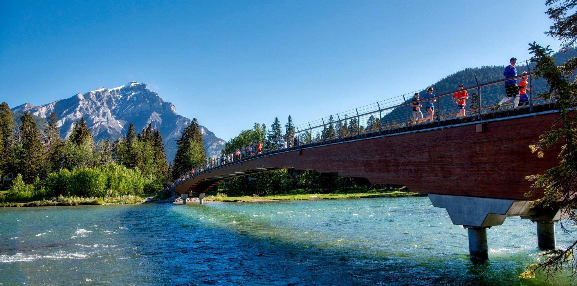 Running along the Banff pedestrian bridge